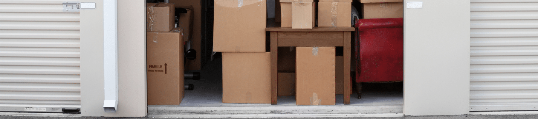 Image of boxes stacked in a storage unit, the title reads